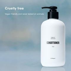 Public Goods conditioner poured on hand to show creamy texture for easy application