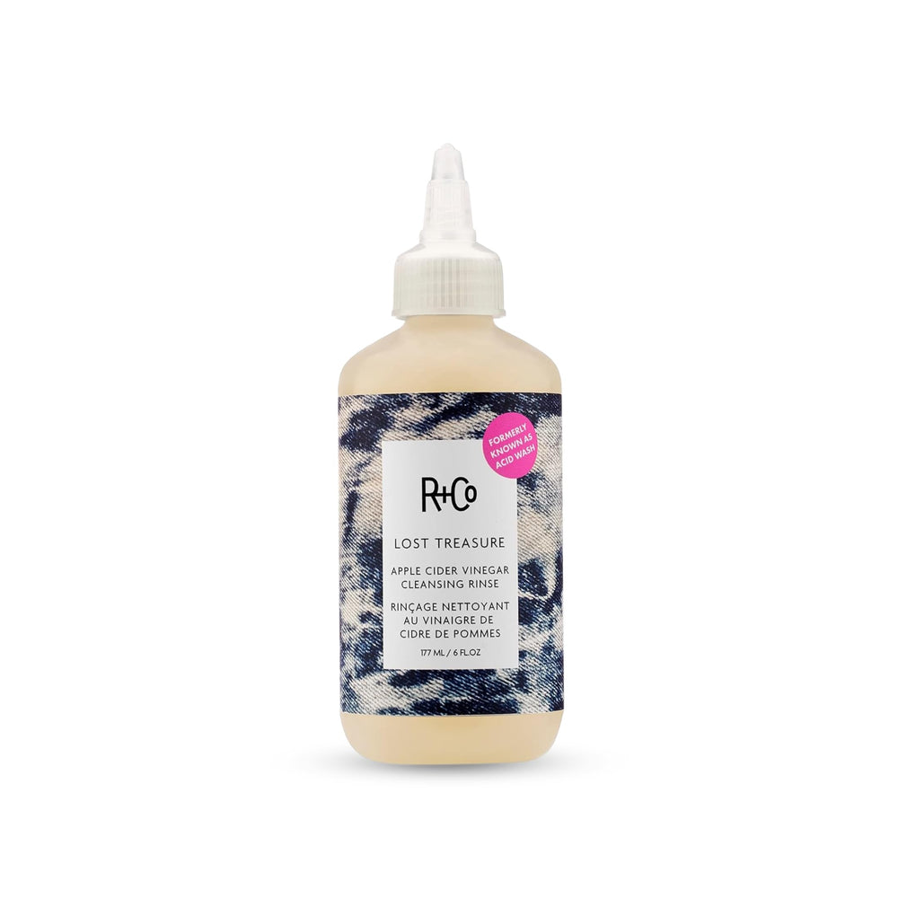 R+Co bottle front view showing label and compact 6 oz size for travel convenience