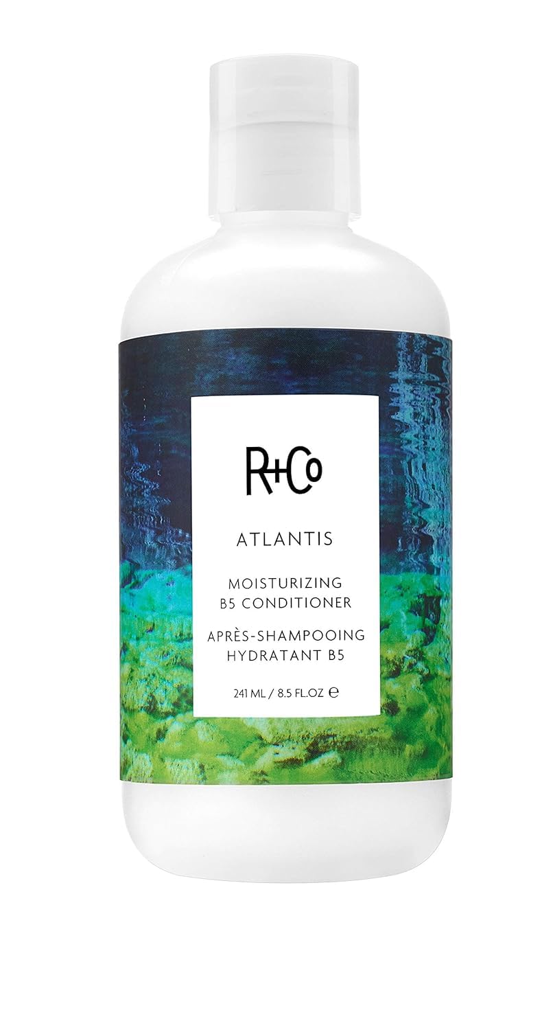 R+Co ATLANTIS front packaging showing bottle and rosy eyed scent benefit
