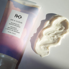 R+Co being applied to wet hair for smoothing and repair benefits