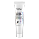 Redken bottle front packaging showing product and benefit of repair
