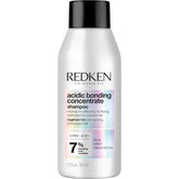 Redken bottle front view showing product and concentrated repair benefit