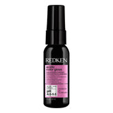 Redken bottle front packaging showing product and salon-grade shine benefit