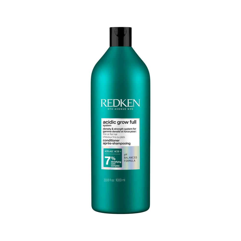 Redken conditioner's front label showing product name and size for clear identification