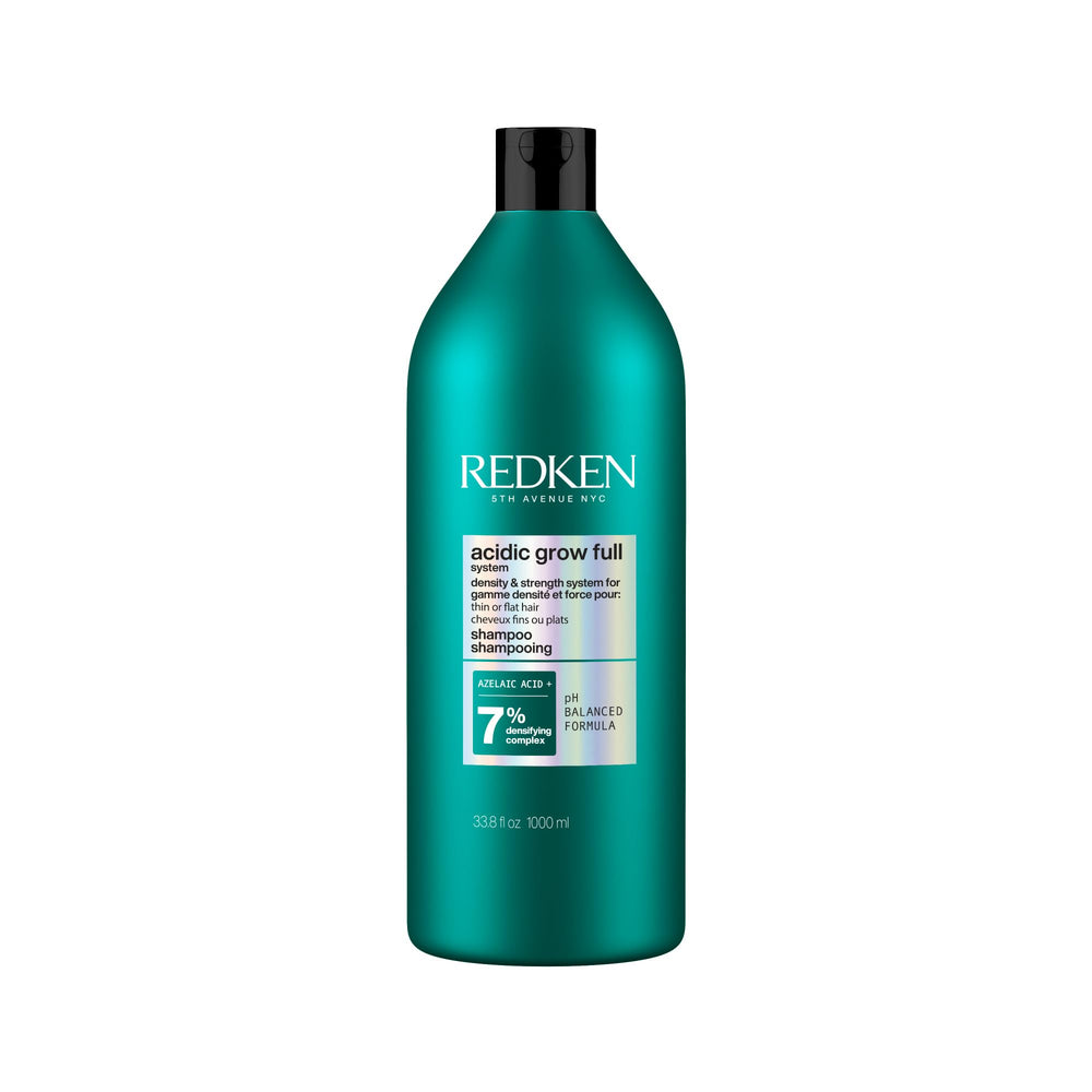 Redken bottle front view shows clear branding and volumizing benefit