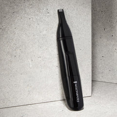 Remington NE3150 held in hand showing travel-friendly lightweight design