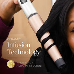 Remington wand held in hand to show scale and easy handling for precise styling
