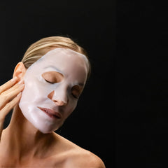 Revision Skincare removed mask leaving serum on hands indicating concentrated hydration
