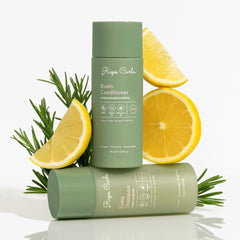 Rizos Curls bundle next to passport and toiletries showing travel-friendly size and convenience