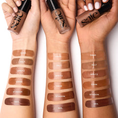Saie Dew Bronze arm swatches showing shade Spritz payoff and buildable coverage