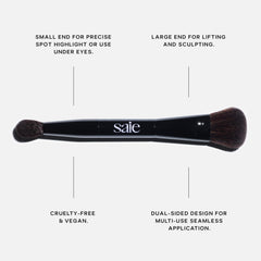 Saie brush in use applying cream highlighter to cheekbone for seamless glow
