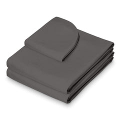 Saloniture fitted sheet on massage table demonstrating secure fit and stability