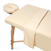 Saloniture sheets on massage table showing complete set and professional look