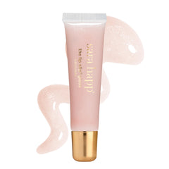 Sara Happ gloss front tube showing sleek packaging and high-shine appeal