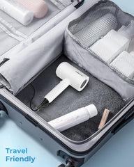 SHRATE hair dryer in hand for travel-size convenience and portable benefit