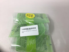 Simple tubes next to travel bag, illustrates portable 150ml size convenience