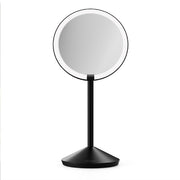 simplehuman front view of round mirror showing Tru‑Lux light and 10X magnification benefit