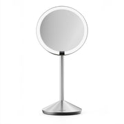 simplehuman front open mirror showing full Tru-Lux light and round face reflection benefit