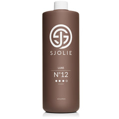 SJOLIE SUNLESS front bottle showing label and 32oz size for professional use