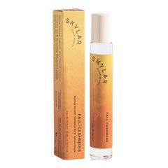 Skylar rollerball front view showing compact travel bottle and warm design