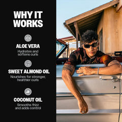 Slick Gorilla man applying cream to damp hair for defined curls and reduced frizz