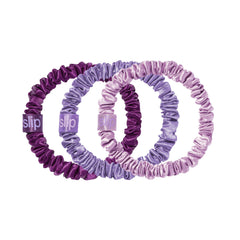 SLIP front packaging with three violet silk scrunchies shows soft luxury