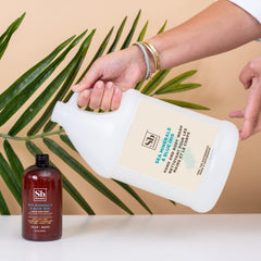 Soapbox being dispensed into hands from a wall pump showing convenient use
