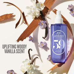 Sol de Janeiro bottle close-up mid-spray highlighting fine mist application and fresh diffusion benefit