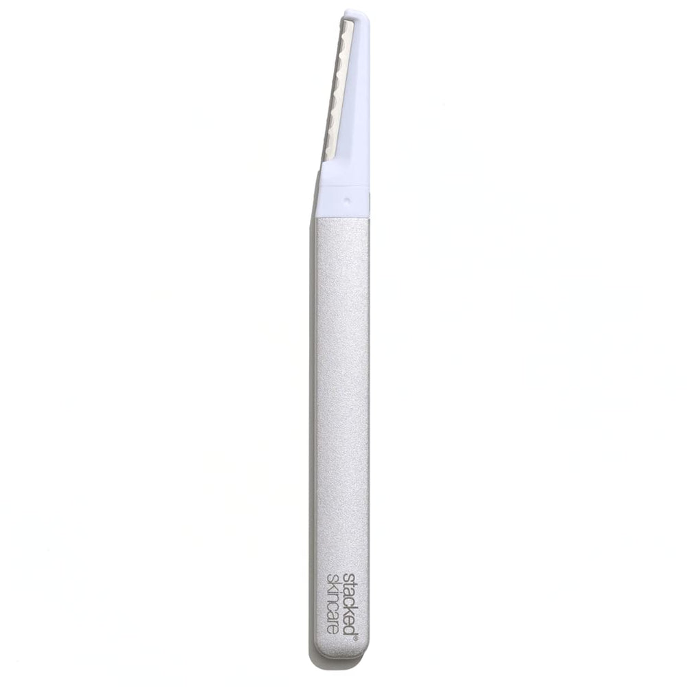 StackedSkincare dermaplaning tool front view showing sleek metal handle and profile for control