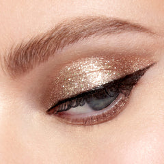 stila product swatched on eyelid demonstrating Kitten Karma brightening and minimal fallout