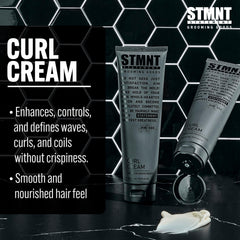 STMNT curl cream in hand ready to apply for improved manageability