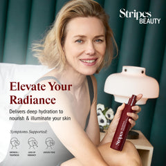 STRIPES applying Full Monty body oil on legs for hydrated visibly softer skin