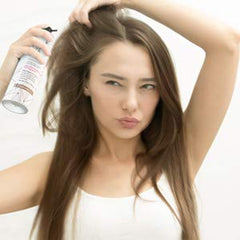 STYLE EDIT spray bottle in hand demonstrating easy, on-the-go touch-ups