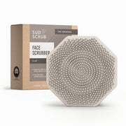 Sud Scrub front view showing clay color and compact design for gentle cleansing