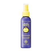 Sun Bum front bottle image showing tone-enhancing spray and easy application benefit