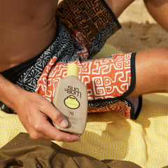 Sun Bum lotion being dispensed from bottle, easy application and no-grease benefit