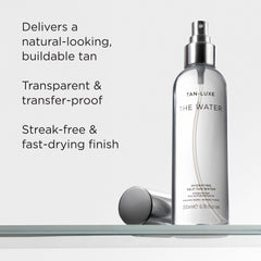 TAN-LUXE being misted on leg for streak-free natural glow