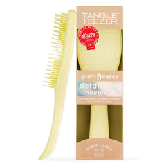 TANGLE TEEZER front view showing yellow brush and compact shape for easy detangling