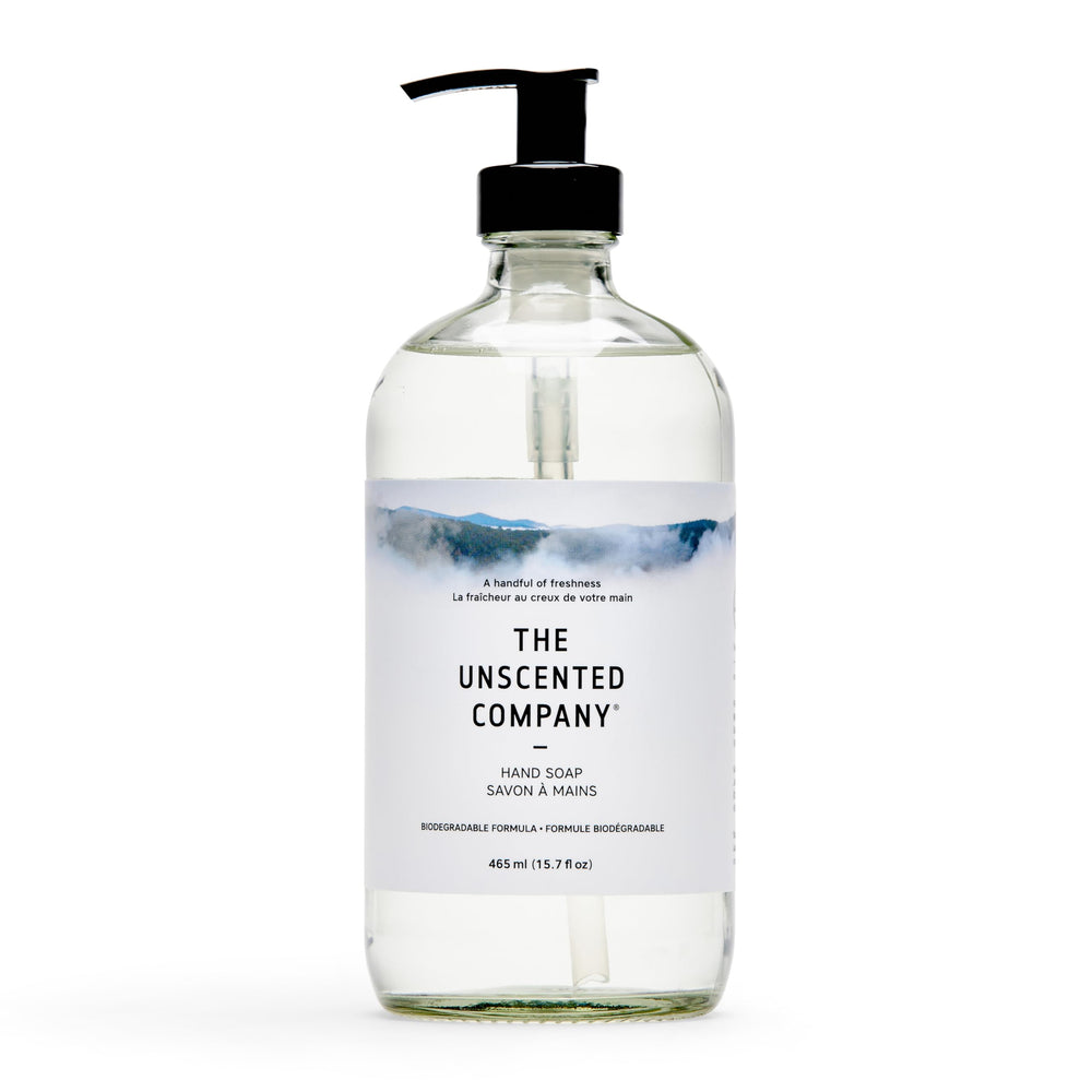 The Unscented Company glass bottle front view showing minimalist label and refillable design benefit