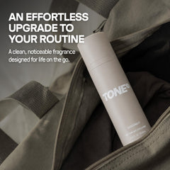 TONE Exclusive bottle in hand illustrating compact 3.4 fl oz travel size
