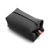 TOOLETRIES Koby front view showing compact charcoal bag and modern styling benefit