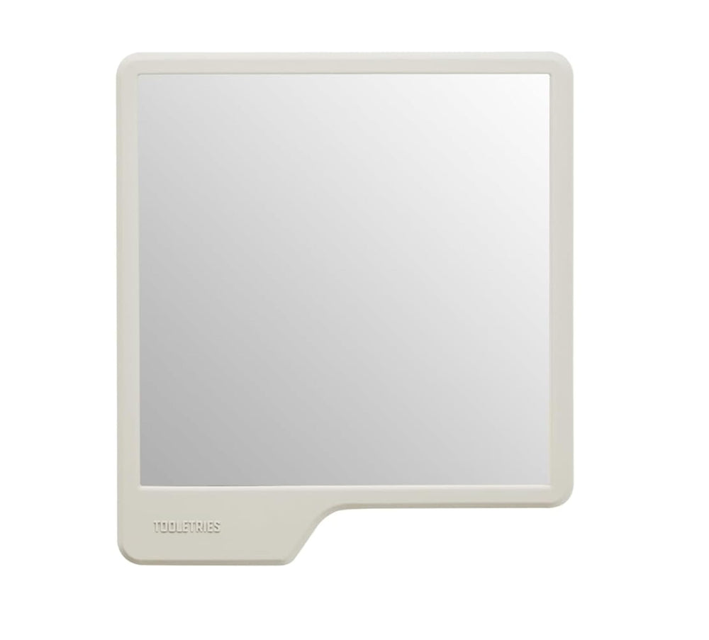 TOOLETRIES Oliver front view in sand showing compact mirror and clean finish benefit