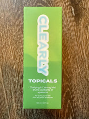 Topicals mist spraying into hand for quick, even acne treatment