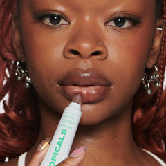 Topicals slick salve mint applied on lips for instant hydration and shine