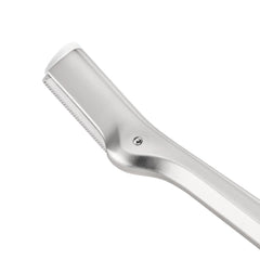 Tweezerman blade close-up highlighting stainless steel edge for smooth, low-irritation strokes