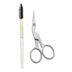 Tweezerman front view of scissors and brush showing compact travel-ready grooming