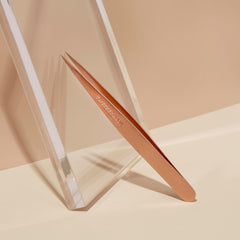 Tweezerman tweezer removing eyebrow hair in use for precise grooming control