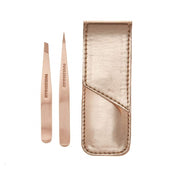Tweezerman petite set front view showing rose gold finish and travel case benefits
