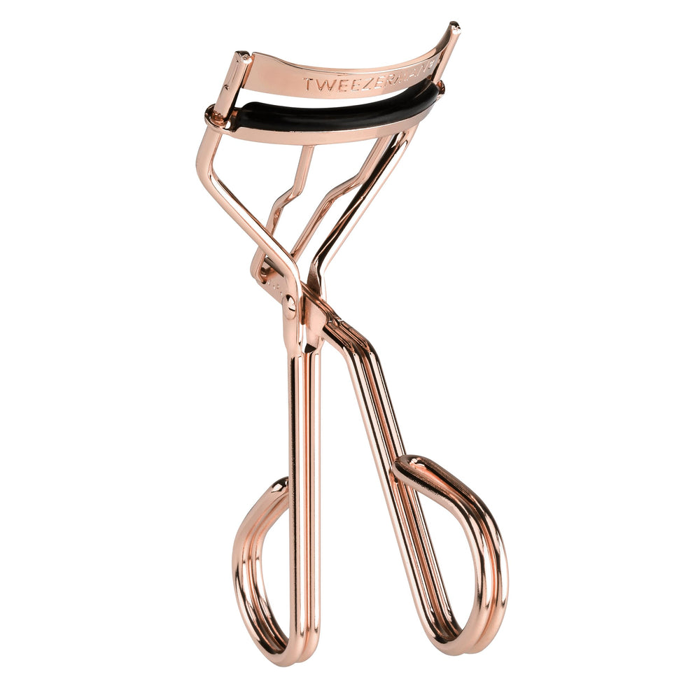 Tweezerman ProCurl front view showing rose gold finish and ergonomic shape for precise curling