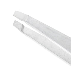 Tweezerman slant tip close-up highlighting hand-filed alignment for accuracy